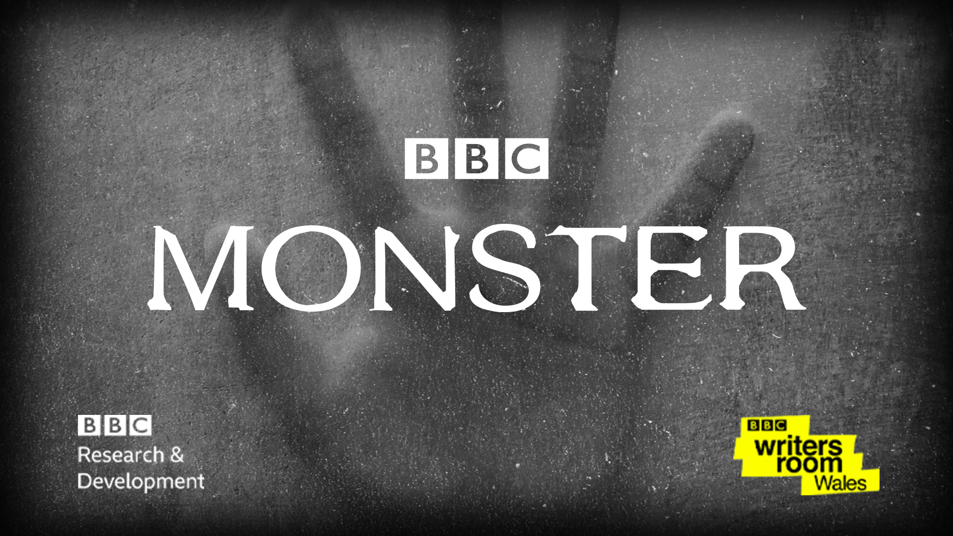 Promotional image for Monster, with the title and production partner logos on top of a picture of a hand with a grainy overlay