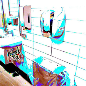A high contrast image of a shiny workplace bathroom, as seen from the perspective of someone with a neurodivergent condition.
